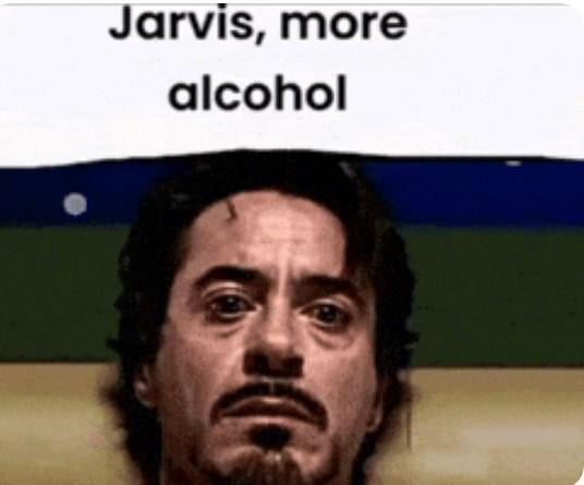 Still of Robert Downey Jr. as Tony Stark/Iron Man from the Marvel Cinematic Universe, lying down with a tired and depressed expression on his face. Caption - "Jarvis, more alcohol"